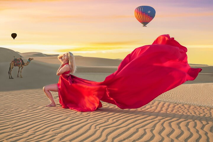 Experience the magic of Dubai's desert at sunset where stunning landscapes and flowing dresses create unforgettable moments perfectly captured for your social media showcase.